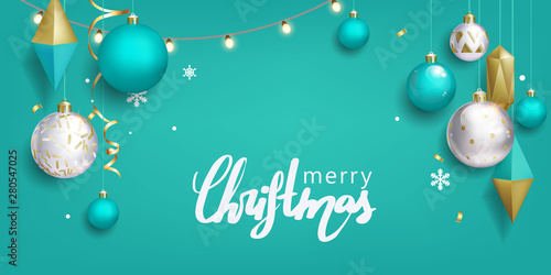 Christmas greeting card with balls on turquoise background