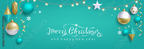 Christmas greeting card with balls on turquoise background