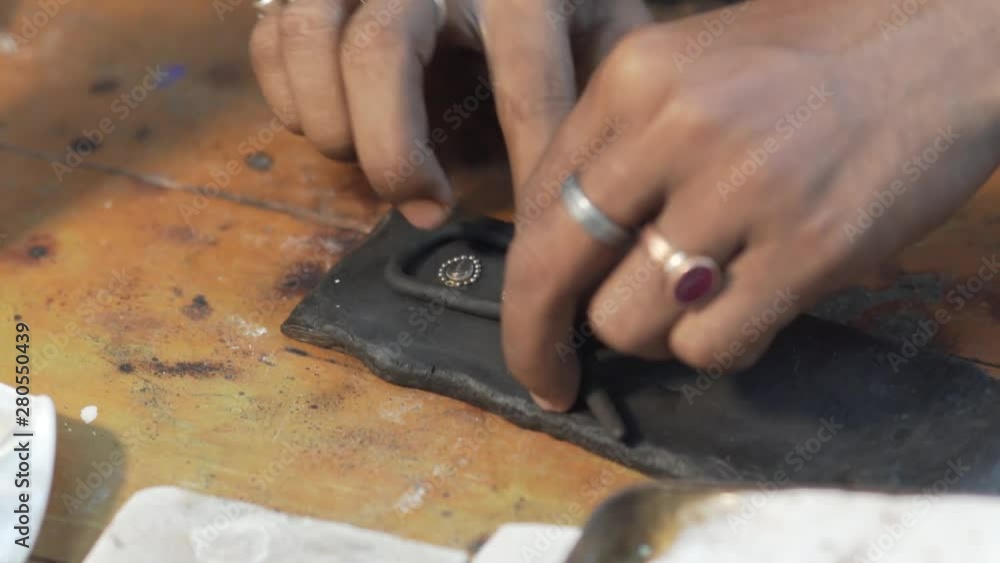 A part of the process of working on jewelry.Indian worker is at a workshop and making jewellery A part of the process of working on jewelry.Indian worker is at a workshop and making jewellery