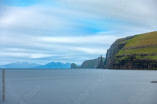 Sandoy rock needle in the steep coastline, long exposure © F.C.G.