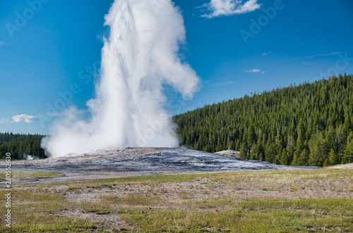 Eruption of Old Faithful Geyser, main attraction of Yellowstone National Park.