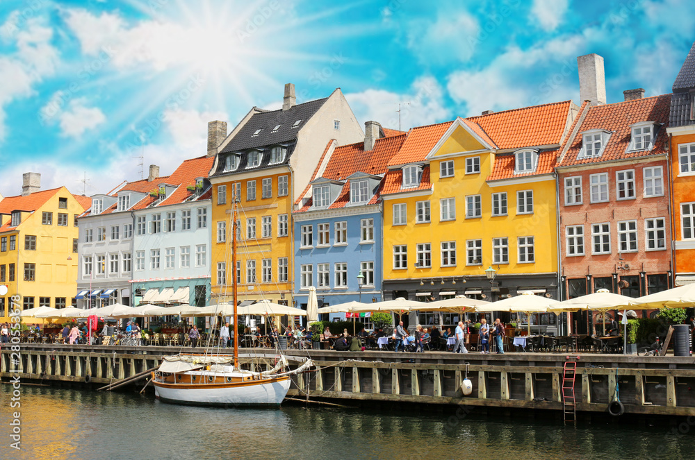 Fototapeta Panorama of north side of Nyhavn with colorful facades of old houses and old ships in the Old Town of Copenhagen