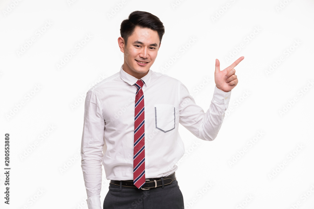 Asian businessman standing and point his finger.. Asian businessman standing and point his finger..