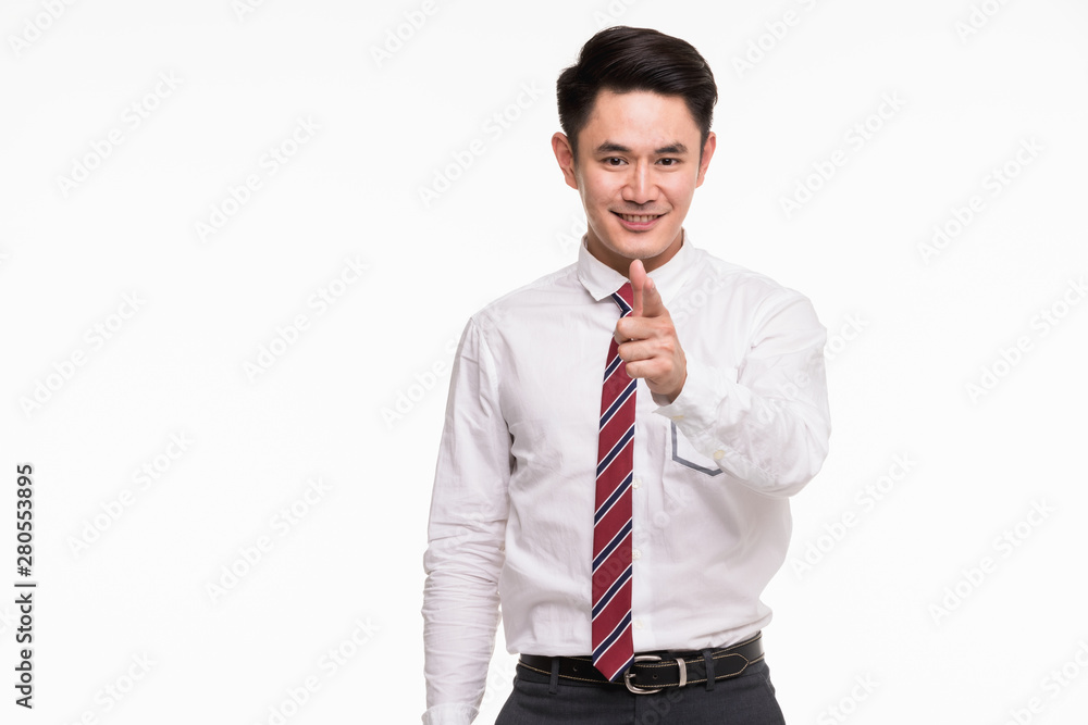 Asian businessman standing and point his finger.. Asian businessman standing and point his finger..