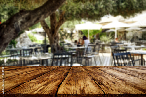 Table background  in a outdoor restaurant view. Empty  space for your decoration and advertising products.
