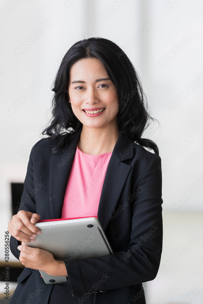 Businesswoman holds tablet computer in her hands.. Businesswoman holds tablet computer in her hands..