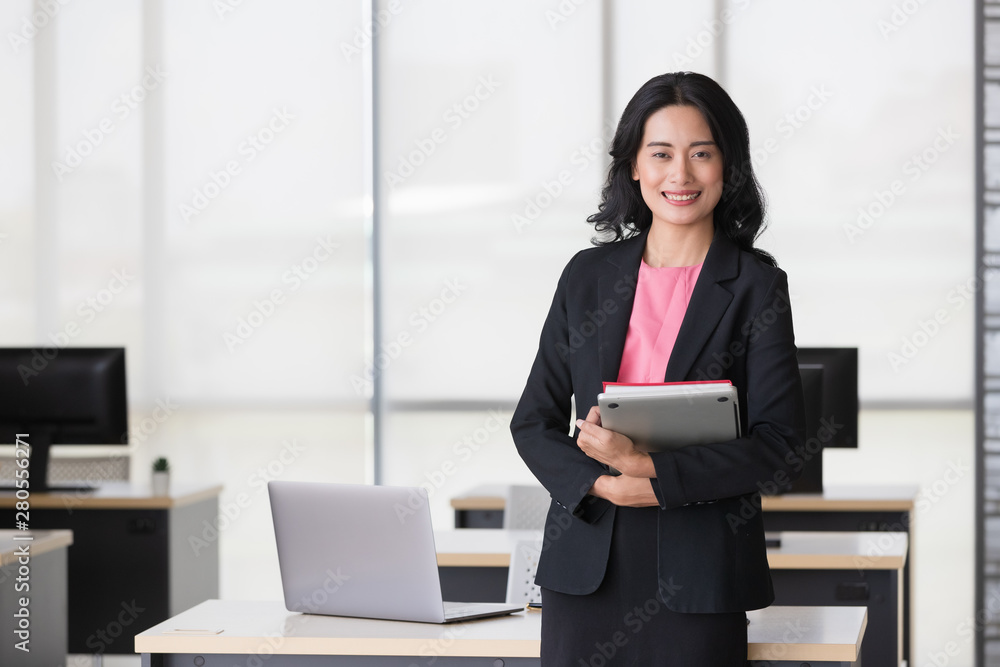 Businesswoman holds tablet computer in her hands.. Businesswoman holds tablet computer in her hands..