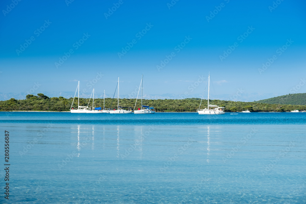 Beautiful seascape on Adriatic sea in Croatia, Dugi otok island, sailing boat on seashore