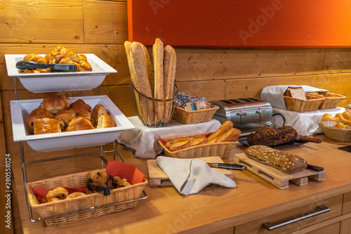 Assorted fresh pastry on table in breakfast buffet in hotel