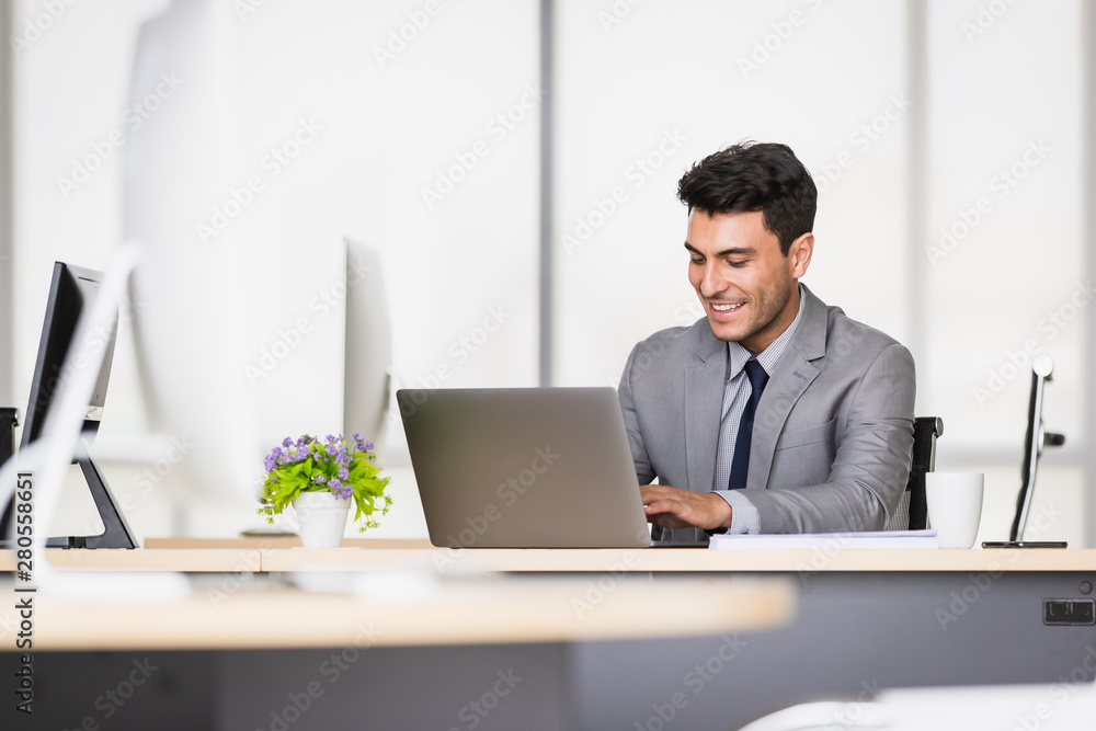 Caucasian businessman holding a pen in his hands.. Caucasian businessman holding a pen in his hands..