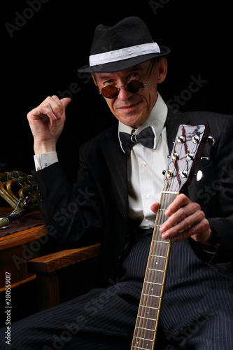 Photography Portrait of an elderly jazz musician in retro style