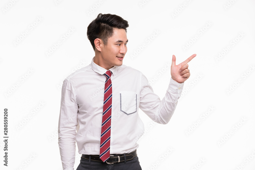 Asian businessman standing and point his finger.. Asian businessman standing and point his finger..