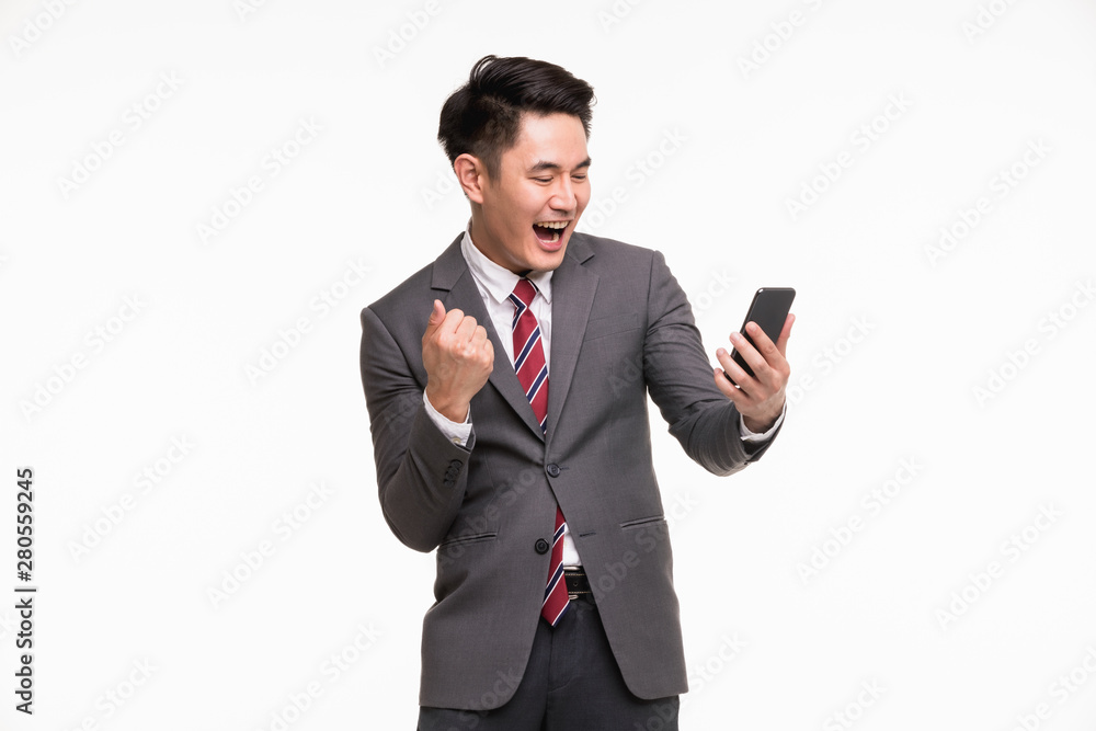Businessman using smartphone, excited by it.. Businessman using smartphone, excited by it..