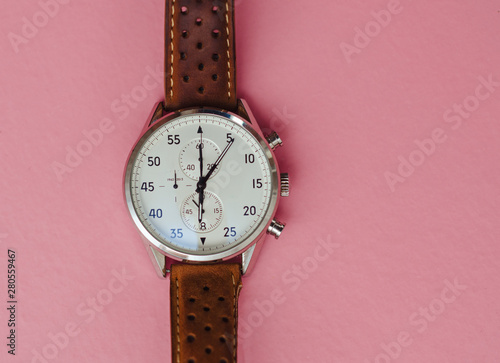 men's wrist watch on a pink background