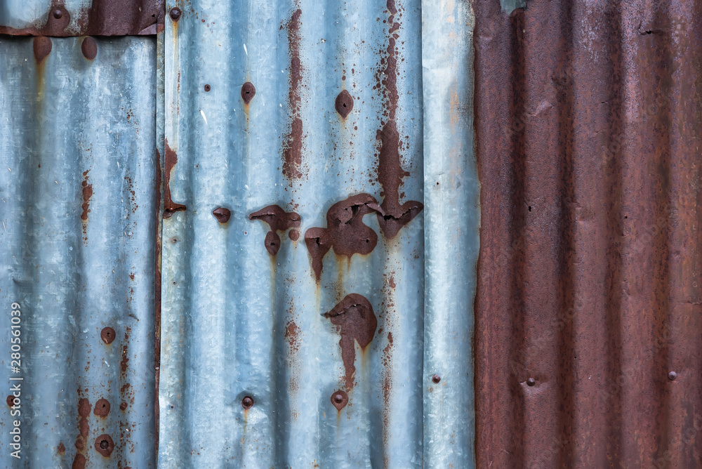 Old zinc texture background.Old rusty galvanized, corrugated iron siding vintage texture background, Rusty corrugated metal wall. Old zinc texture background.Old rusty galvanized, corrugated iron siding vintage texture background, Rusty corrugated metal wall.