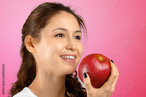 Portrait of girl with red apple isolated