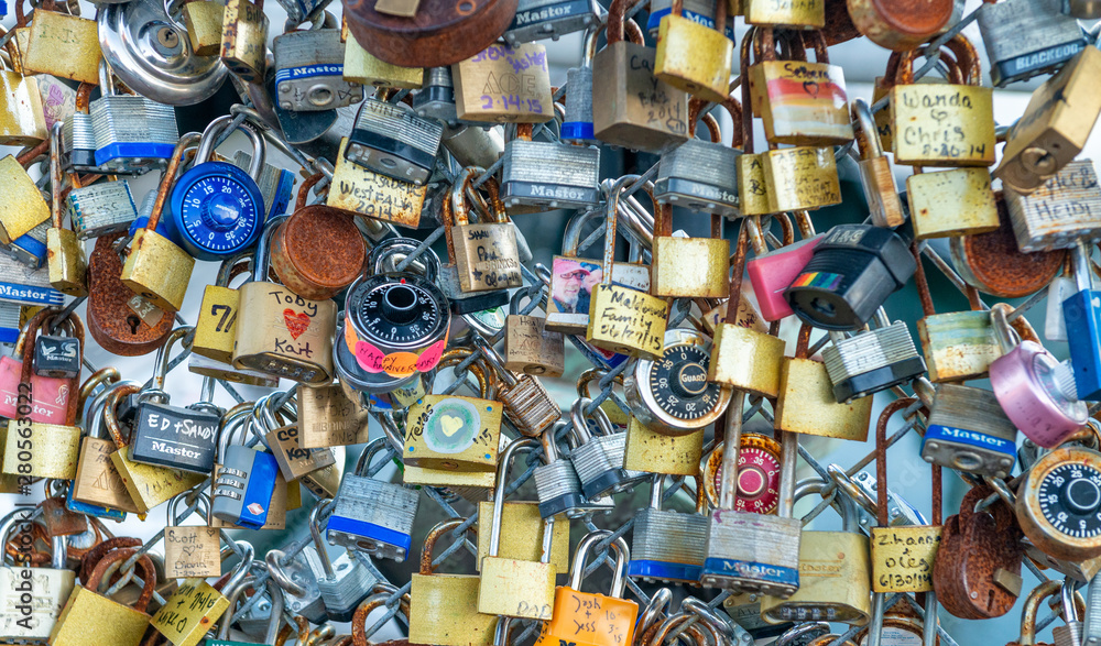 PORTLAND, MAINE - OCTOBER 16, 2015: Padlocks along city waterfront. They are a way to freeze a moment