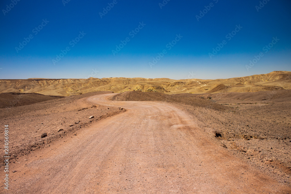 desert nature scenery landscape with lonely trail in sand dunes wilderness environment and horizon mountains background desert nature scenery landscape with lonely trail in sand dunes wilderness environment and horizon mountains background