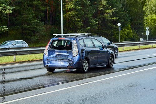 Accident on a highway, car after a collision with a bus