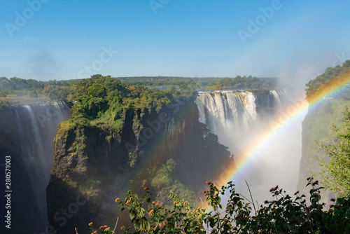 picture of the Victoria Falls and a rainbow while beautiful sunlight
