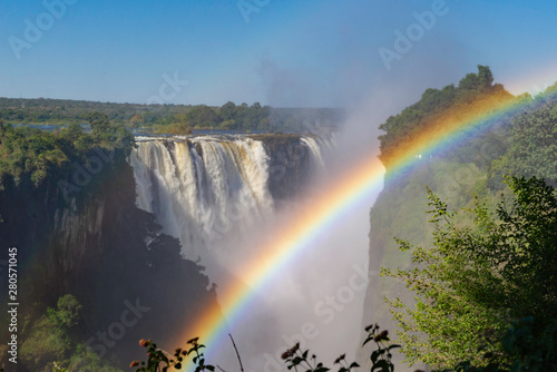 picture of the Victoria Falls and a rainbow while beautiful sunlight