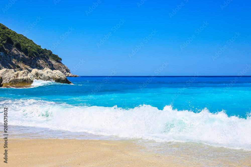 Obraz premium Waves on the Myrtos beach, Kefalonia island, Greece
