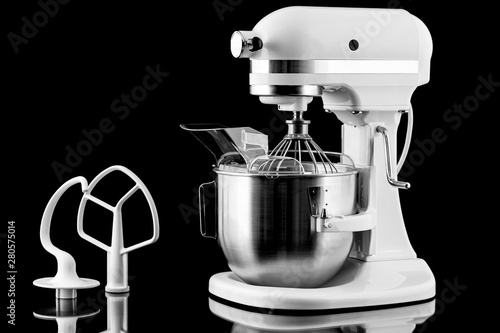 White kitchen mixer isolated on a black background