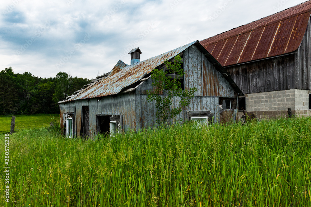 landscape of abandoned old barns