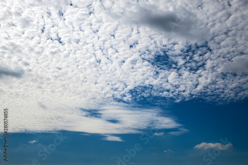 Soft white clouds against blue sky background