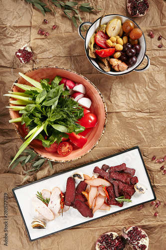 Traditional Azerbaijani Cuisine Set with Fresh Vegetables and Greens, Cold Cuts Of Dried Beef, Chicken and Sujuk