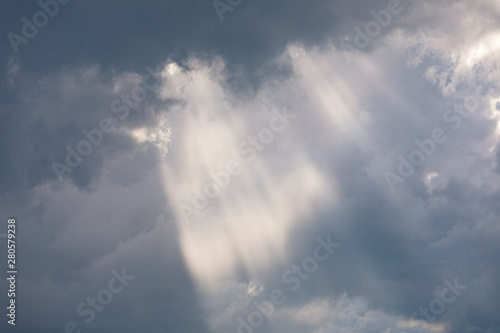 Vivid sunbeam light ray from clouds © Juhku