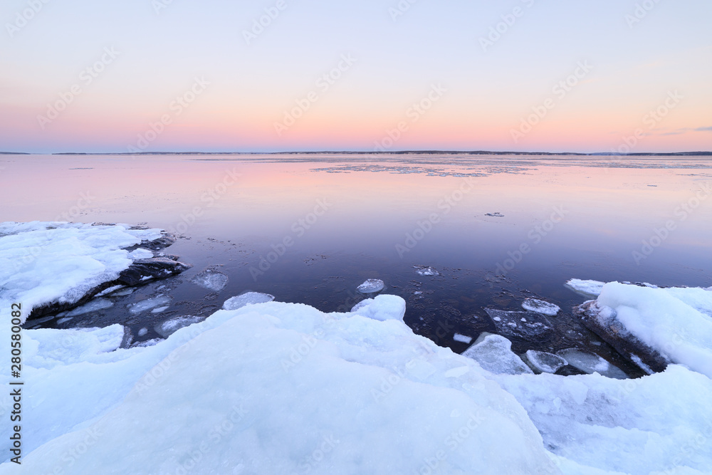 Lake scenery at dusk winter in Finland