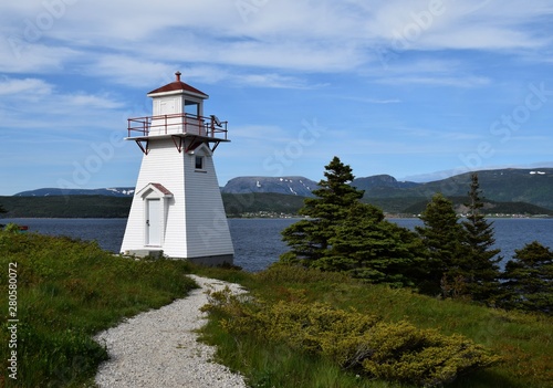 Bild auf Leinwand closeup of the red and white lighthouse in Woody Point, Gros Morne National Park