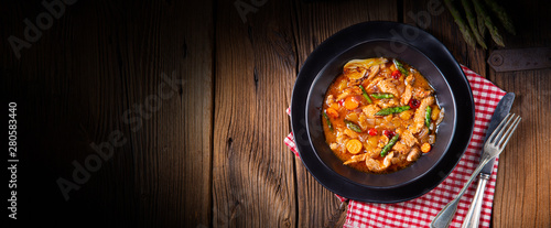 colorful turkey fricassee with asparagus and paprika