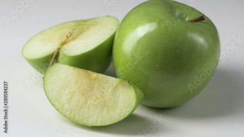 Wallpaper Mural Rotating green apple on white background Torontodigital.ca