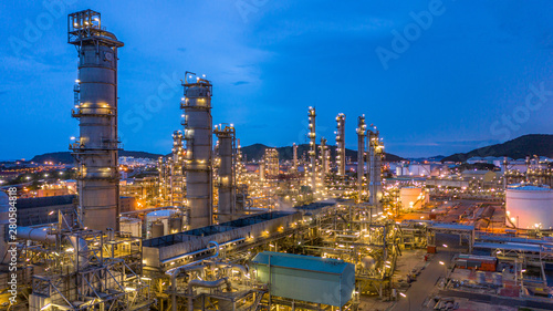 Aerial view petrochemical plant and oil refinery plant background at night,  Petrochemical oil refinery factory plant at night.