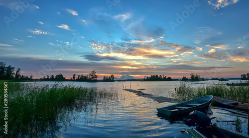 Fotografie Colorful sunset on lake Vuoksa in the Leningrad region