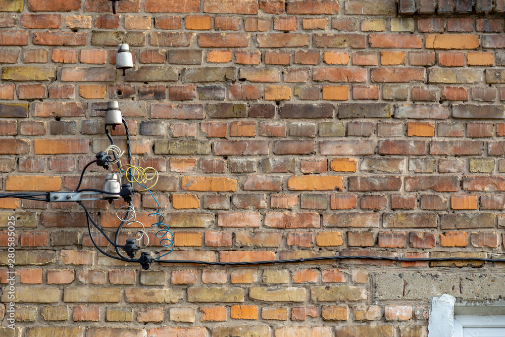 Backgrouhnd with copy space of Brick wall with electrical wires and ...