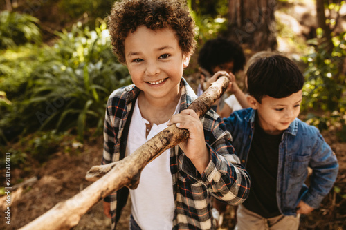 Photography Children building camp in forest