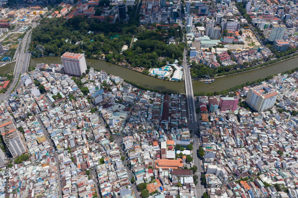 Top View of Building in a City - Aerial view Skyscrapers flying by drone of Ho Chi Mi City with development buildings, transportation, energy power Top View of Building in a City - Aerial view Skyscrapers flying by drone of Ho Chi Mi City with development buildings, transportation, energy power