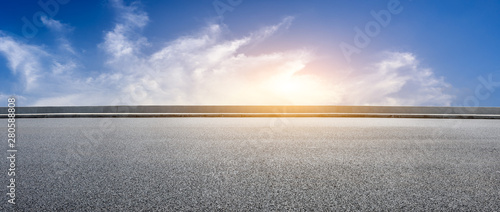 Asphalt highway and beautiful clouds landscape at sunset