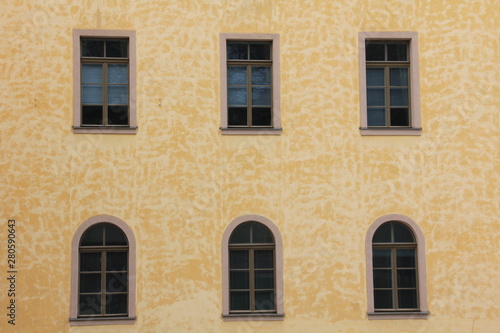 Windows on old stone wall