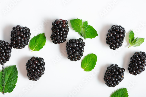 Closeup of fresh blackberries and mint leaves, top view