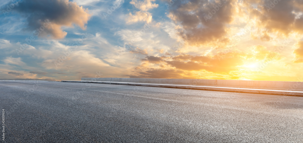 Asphalt highway and beautiful clouds landscape at sunset Asphalt highway and beautiful clouds landscape at sunset
