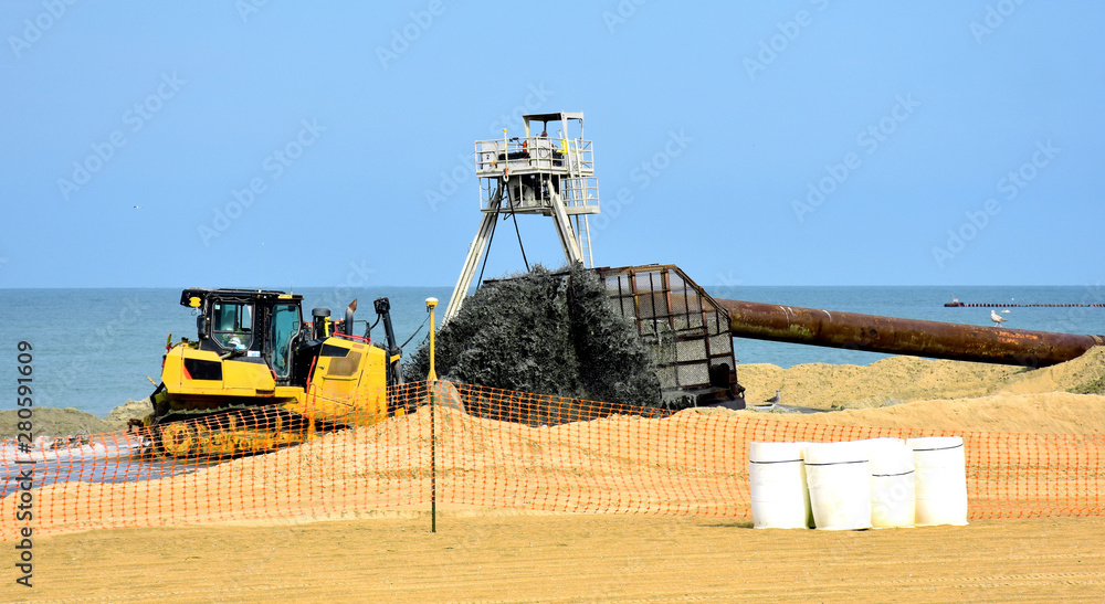 Work on a project to widening the beach, Virginia Beach, USA