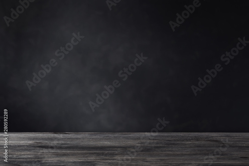 background with wooden table and dark wall © Maya Kruchancova