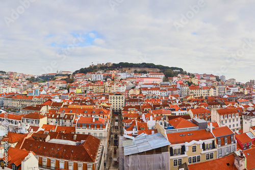 Lisbon Portugal - Beautiful panoramic view of the red roofs of houses in antique historical district Alfama and the Tagus River and bridge from Sao Jorge Castle