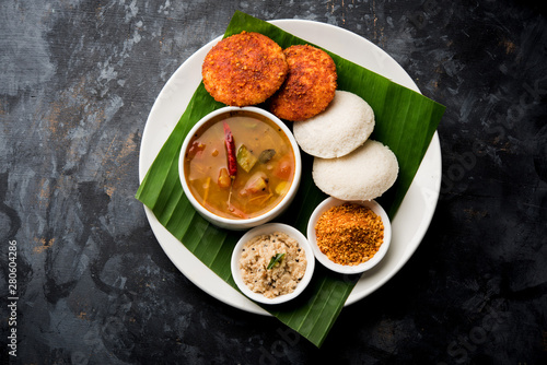 Podi idli is a quick and easy snack made with leftover idly. served with sambar and coconut chutney. selective focus