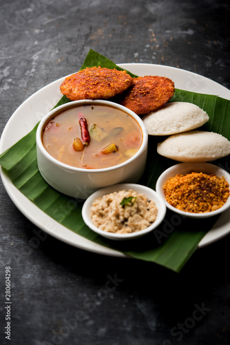 Podi idli is a quick and easy snack made with leftover idly. served with sambar and coconut chutney. selective focus photo