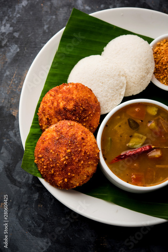 Podi idli is a quick and easy snack made with leftover idly. served with sambar and coconut chutney. selective focus photo